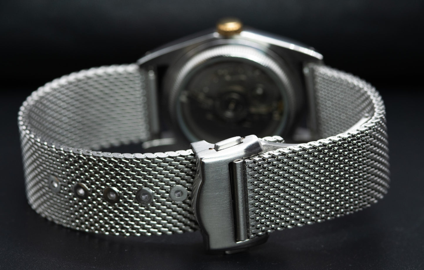 Two Tone fluted bezel watch in vintage style case. two tone fluted dial. drilled lugs. stainless steel mesh bracelet