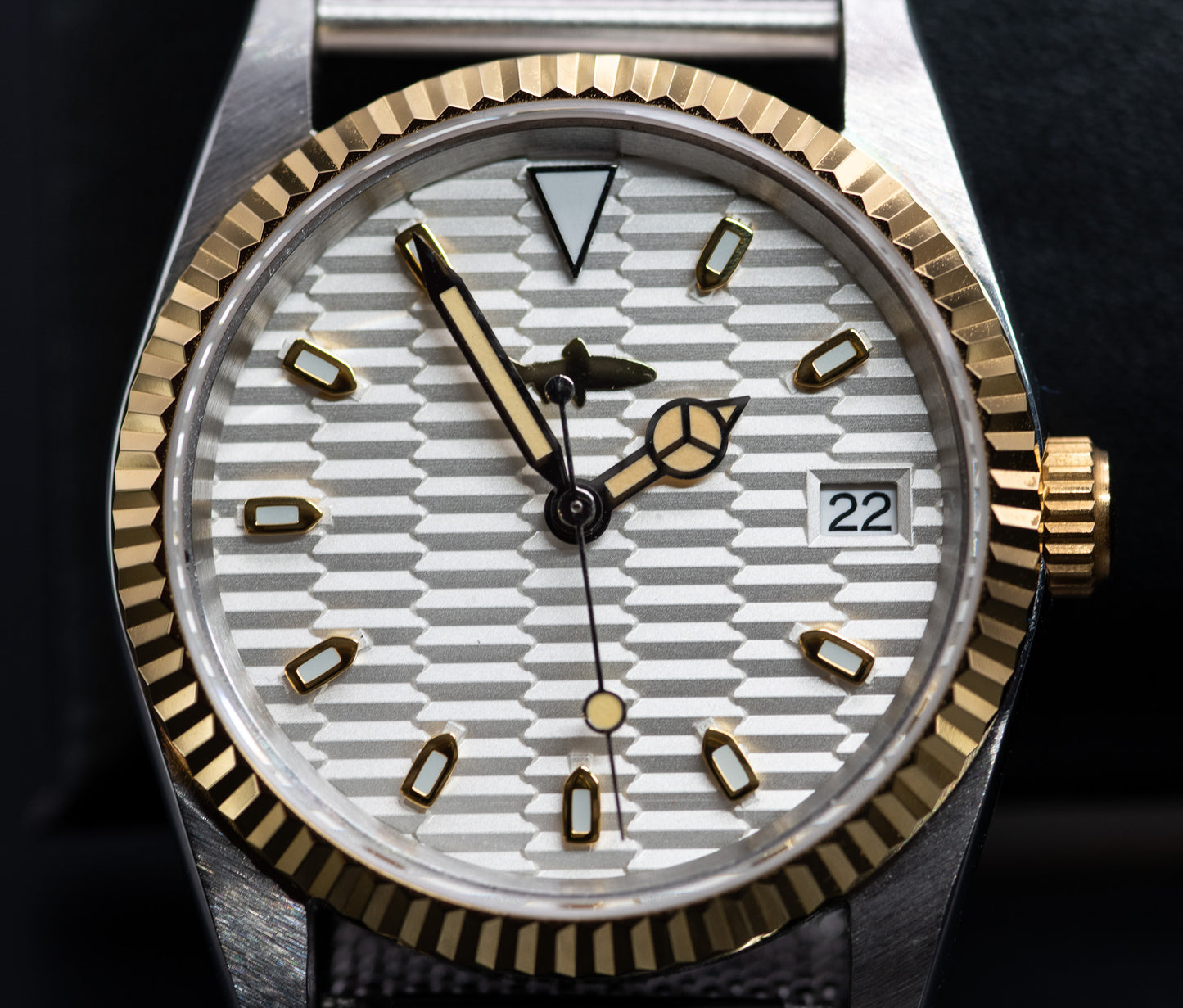 Two Tone fluted bezel watch in vintage style case. two tone fluted dial. drilled lugs. stainless steel mesh bracelet